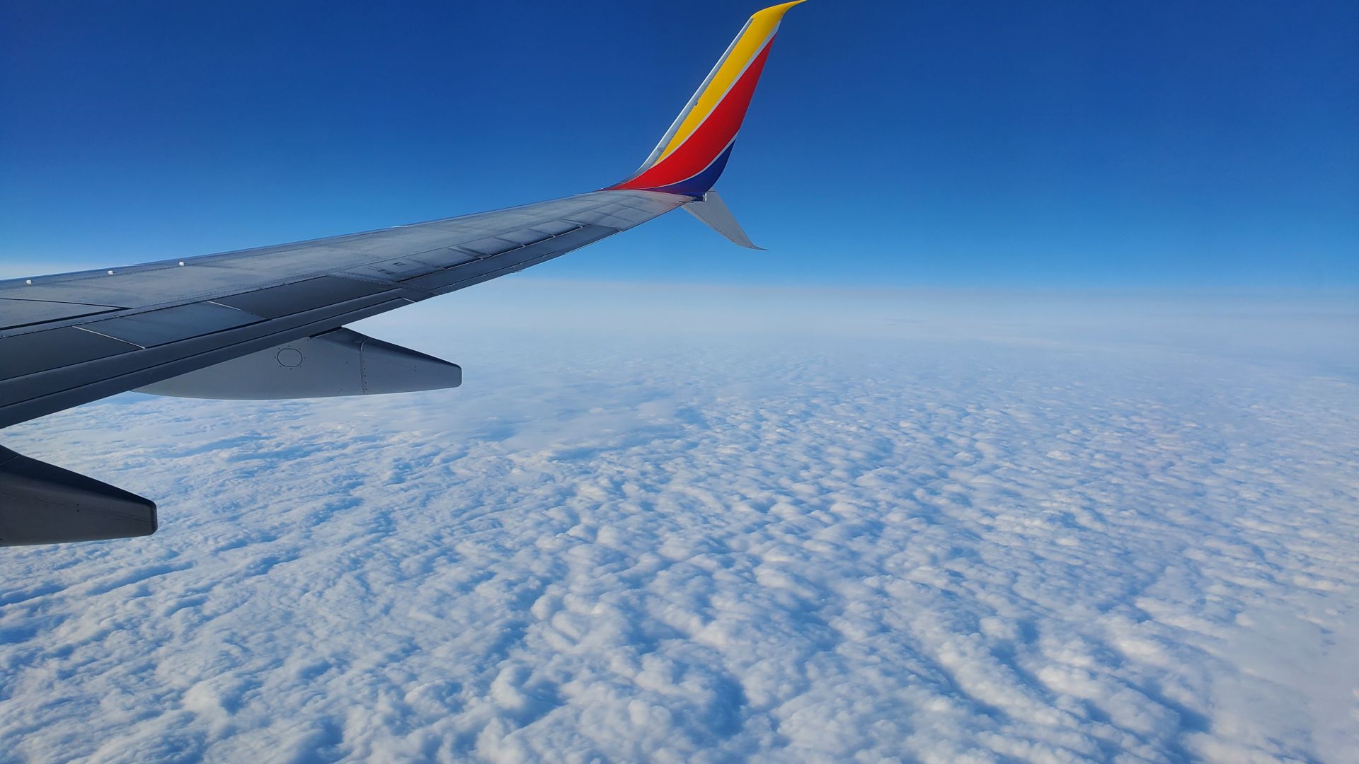 The top of clouds from inside a plane